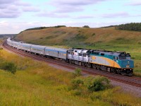 VIA's eastbound Canadian passes through the s curve at Arrow River. The second unit still wears the "Coors scheme.
