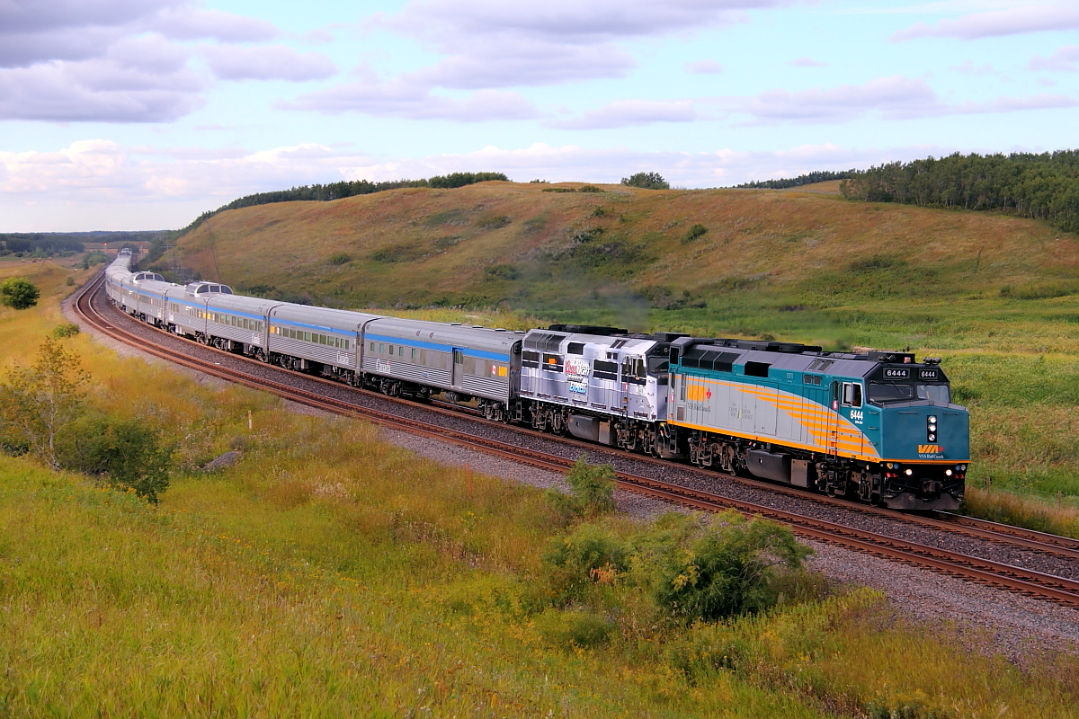VIA's eastbound Canadian passes through the s curve at Arrow River. The second unit still wears the "Coors scheme.