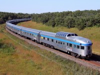 VIA's westbound Canadian passes through Grant's Cut just east of the the town of Rivers.