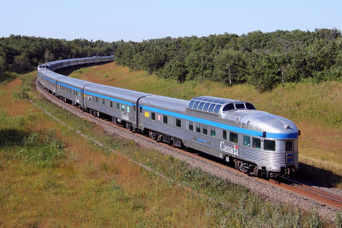VIA's westbound Canadian passes through Grant's Cut just east of the the town of Rivers.