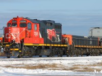 The current switcher unit in Thunder Bay, GP9RM 7258 and GP9 slug unit 211, idles near the yard office in Thunder Bay North with a string of hoppers cars destined for one of the local elevators. Very little grain moves during the winter period once Lake Superior has iced over and lake shipping pauses for the winter.