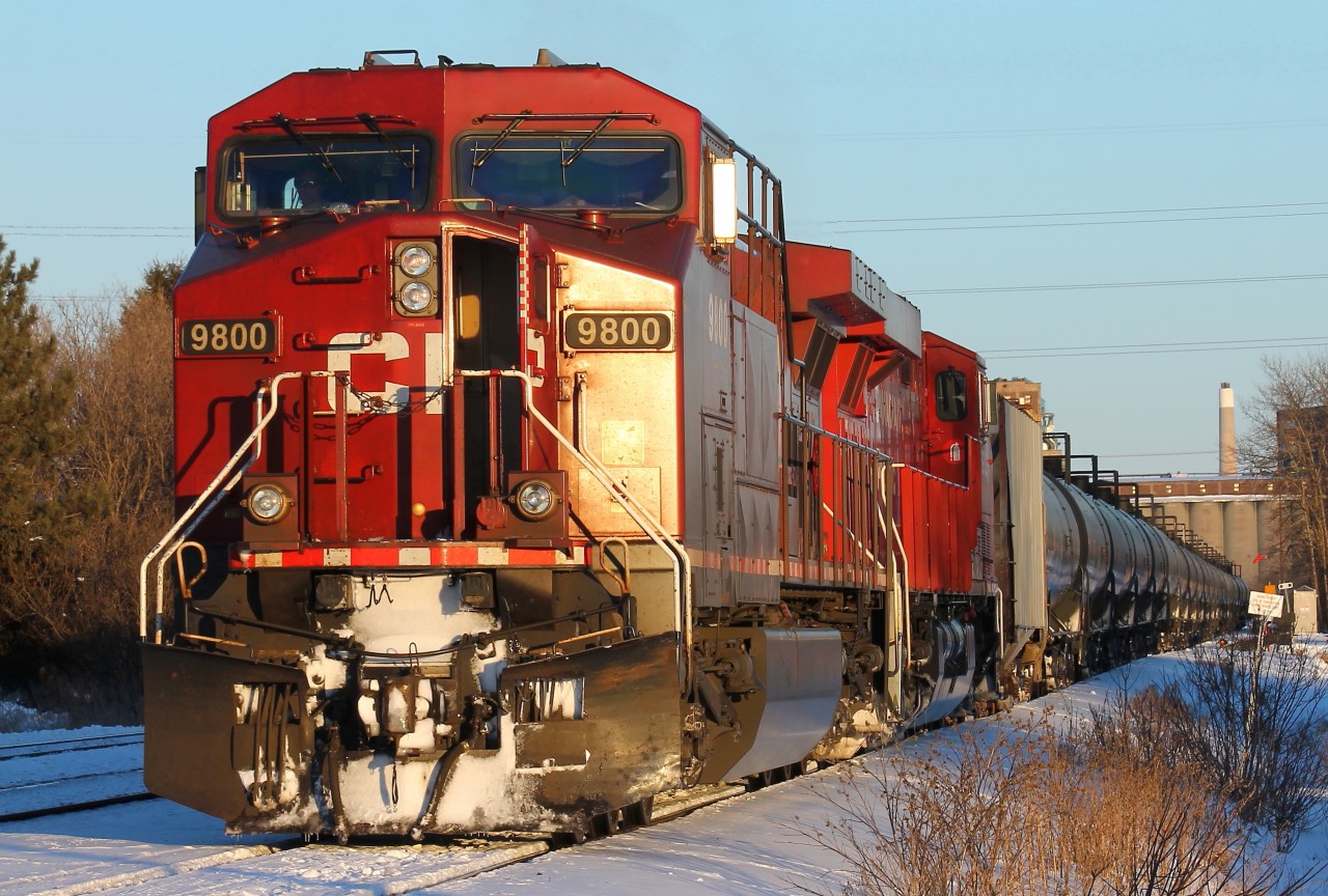 The Westfort carmen have inspected this train of empty crude oil tank cars. CP 9800 is using the running lead, which parallels the CP mainline westward from the yard, to  switch out the 'bad order' car 42 times back from the head end before heading west into the waning light.