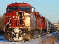 The Westfort carmen have inspected this train of empty crude oil tank cars. CP 9800 is using the running lead, which parallels the CP mainline westward from the yard, to  switch out the 'bad order' car 42 times back from the head end before heading west into the waning light.