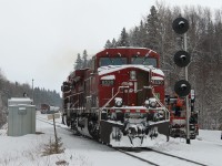 The originating crew on train 608 [crude oil loads] have parked their train in the siding at Gravel during the night.  As the only road access here is near the west switch, the head end power  – cp9702 / cp8530 – was brought  to the west end and positioned in the siding near the tail end remote. The new crew has arrived and is backing the head end power out of the siding onto the main line. They will then proceed eastward  to the east switch, back onto the train and continue on to the next crew change point at Schreiber.