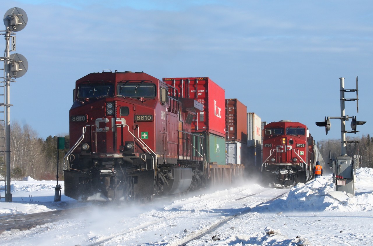 At the west switch Martin, the rear remote on cp train 100 whizzes by westbound cp 8708 in the siding.