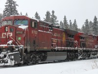 CP 9702 / CP 8530 – is proceeding eastward on the mainline near Gravel on the Nipigon subdivision. Their train [not in picture] is parked on the siding at Gravel.