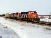 CN 305 speeds through the town with horns blaring.