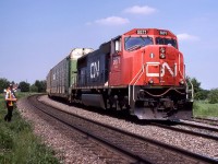 CN 123 with a single loco must be real light to-day with a few auto racks from the 309 ahead of its containers waiting for via 23.