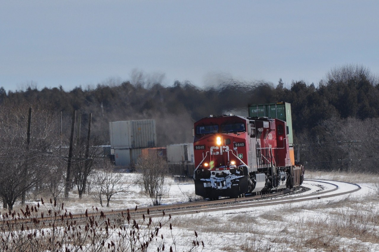 With 9400 feet on the drawbar two Toasters  ( 9840 – 8919 )  are in grilling form.  


  Train #113 is at track speed into the sharp curve at Lovekin. 


 March 5, 2013 image by S.Danko.