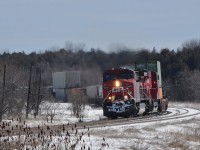   With 9400 feet on the drawbar two Toasters  ( 9840 – 8919 )  are in grilling form.  
<br>
<br>
  Train #113 is at track speed into the sharp curve at Lovekin. 
<br>
<br>
 March 5, 2013 image by S.Danko.
