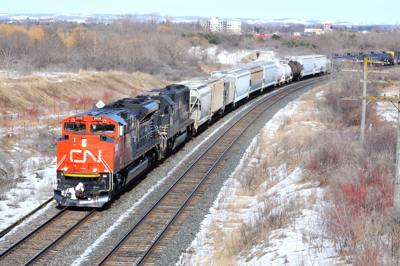 Westbound 8938 – IC 6016 are highballing on the sharp curve exiting Bowmanville mile 292. See next image – same curve thirty one years earlier - with three MLW FP-4's !

March 5, 2013 image by S.Danko.