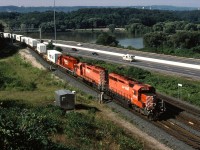 CP 5576 leads SD40 5553 and CPRS 5661 through Desjardins on CP's Hamilton Subdivision on a warm August morning in 1998 with train 557. 