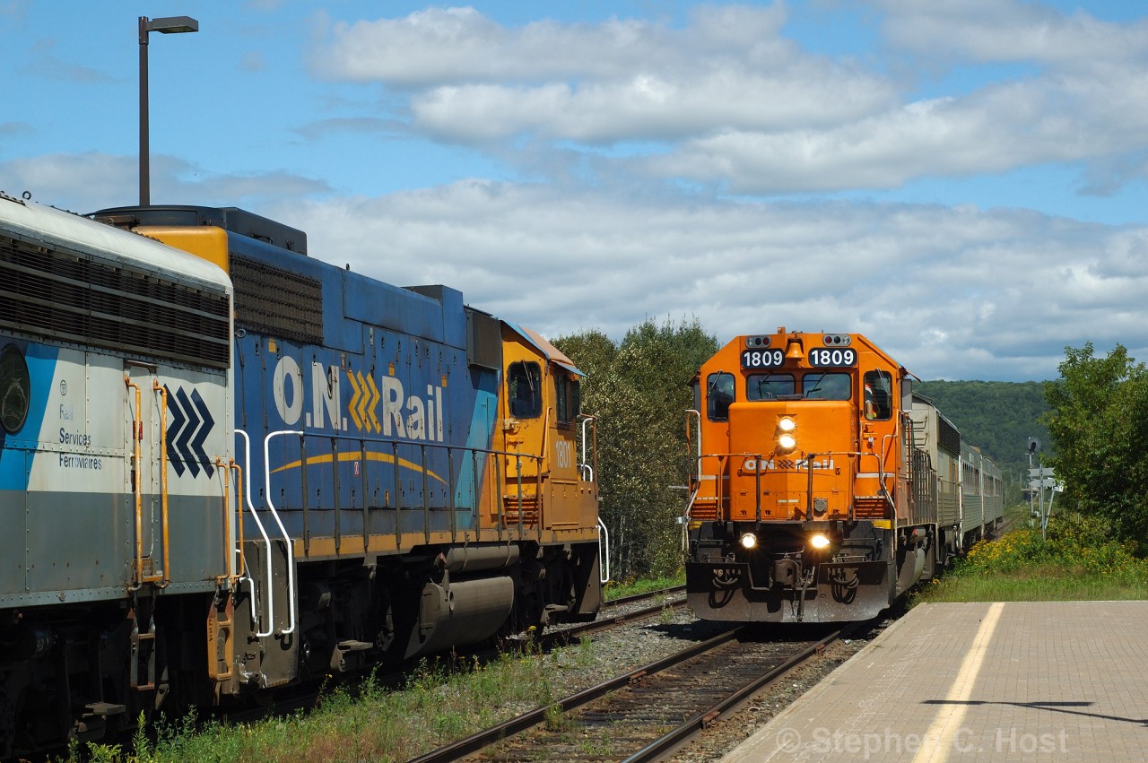 Ontario Northland train 698 has arrived at North Bay and on the left, the power and APU for Train 697 are waiting in the siding. While it may look like a meet of two ONR trains, looks can be decieving. More in next photo..