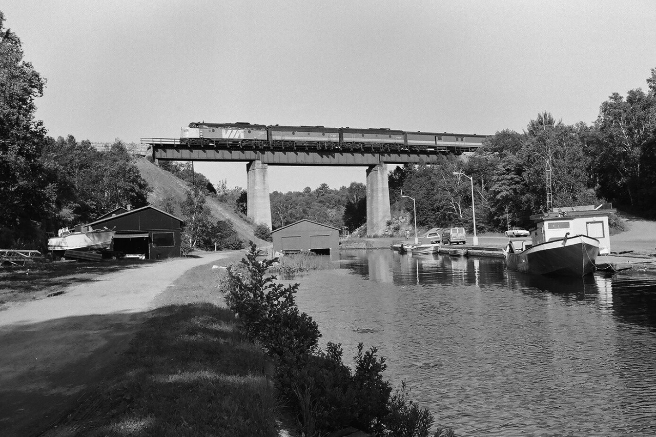VIA Rail train #9 at the Pointe au Baril bridge, Mile 48.5 Parry Sound Subdivision.


The classic A-B-B  GMD built F unit lashup was common during the summer season.


August 4, 1985 negative by S. Danko.


  same train: tail end # 9