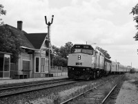 Via train #9, powered by six month old F40PH-2 #6408 – F9B #66xx, rolls by CN Maple mile 18.3 Newmarket Subdivision. Via #9 was a daily 12:35 Toronto Union departure.
<br>
 ( What's interesting:   beside the Maple sign board reads  ' North Bay 210 miles '  [via the Newmarket Subdivision];  note the VIA reflection on the commuter shelter window  ;  station train order board was operational at this time ; see image 8251 for #6408 twenty four years later....).
<br>
 June 1987 negative by S.Danko.
<br>
 More #6408:
<br>
 <a href="http://www.railpictures.ca/?attachment_id=8251"> Coors Lite 6408 </a> 
<br>
<br>
more Maple:
<br>
 <a href="http://www.railpictures.ca/?attachment_id=7285"> ex CP 4066 at Maple </a> 