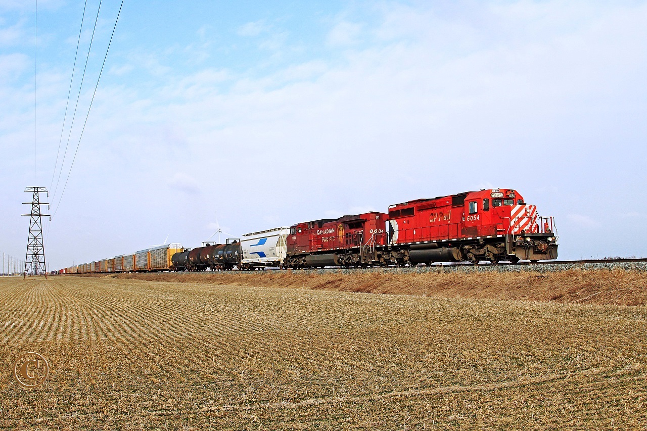 Approaching Haycroft, Multi-Marked CP 6054 with CP 8634 power train 240 eastward across the Essex County prairie at mile 87.9 on the CP's Windsor Sub.
