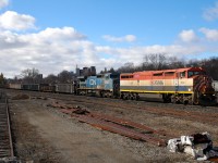 The clouds have parted briefly as 330 rolls downgrade past Brantford with BCOL 4622 - IC 2461