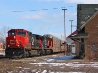 CN 393 powers by the derelict VIA/CN Ingersoll station and it's "modern" counterpart with GE products in the lead.