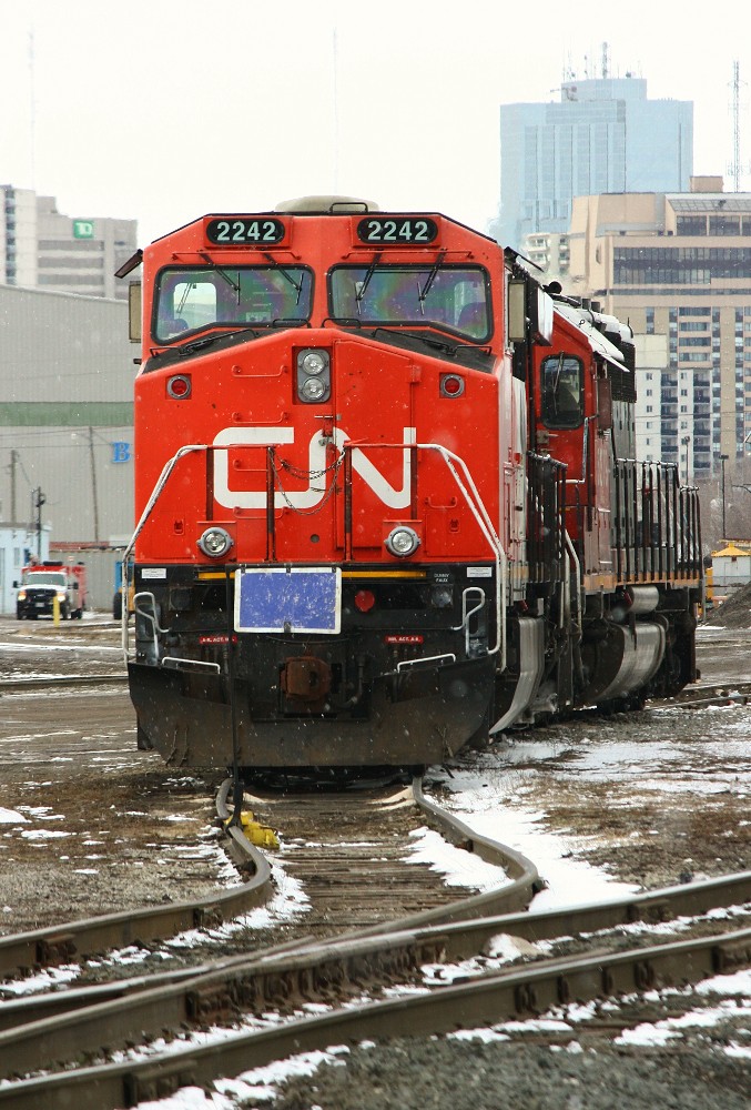 CN 2242 and SD 40-2 5379 sit between the blue-flags on the RIP track in London. Ironically, the previous day I saw CN 23** and 5373 going east through Snake, naturally I mistook them for the same consist. On a side note, I was on the eastbound Via when they passed us at Snake, we waited aprox. 5 minutes for the eastbound to clear the South track as the North was occupied by a stalled train and the train pushing it up the Dundas hill.