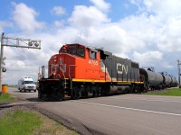 CN's Carberry turn crosses the Trans Canada Hwy just north of the town of Carberry. The small train will head for Petrel Junction where the Carberry Sub joins the Rivers Sub and will make it's way back to Winnipeg.