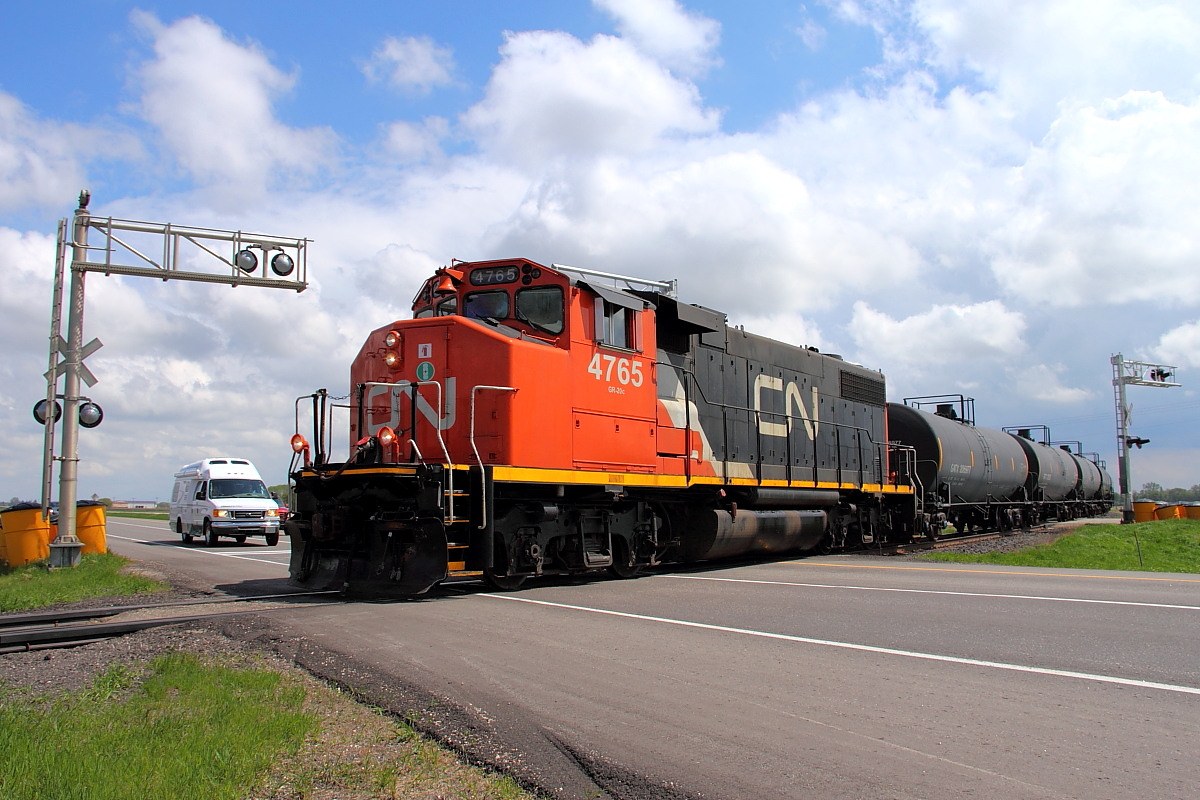 CN's Carberry turn crosses the Trans Canada Hwy just north of the town of Carberry. The small train will head for Petrel Junction where the Carberry Sub joins the Rivers Sub and will make it's way back to Winnipeg.