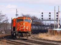 Running a little bit later than normal, CN 331 motors around the big curve just west of the plant at London East, with CN 5663-2449 in command. The track at right is Walker's siding, which becomes the Talbot spur and runs south to St. Thomas.