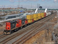 A fine sight out on the road, Belleville Yard power in the form of CN 7083 and 7075 roll 571's train through Liverpool Junction heading up the York Sub. Guess they had nothing better laying around, but if it's good for tonnage, why not? 1502hrs.