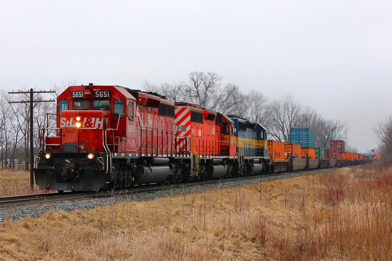 I wasn't really expecting to railfan today, but Andrew Poole warned me of this HOT 142 with one of four remaining STL&H SD40-2's leading a pair of leased units. Now this I couldn't miss! Regardless of the damp overcast afternoon and my freshly washed car I highballed it out to Caledonia road, just East of Chatham. A decision I won't regret!