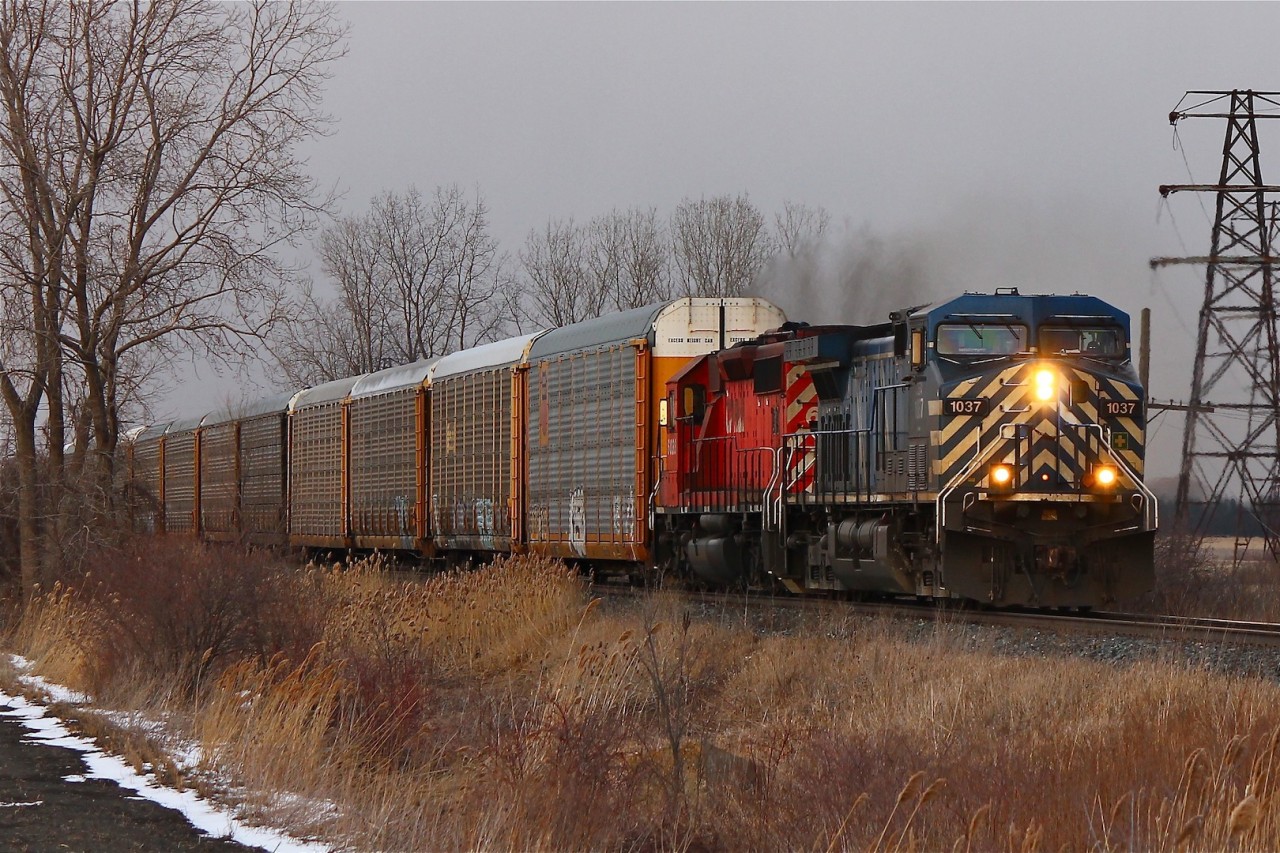 With the light fading quickly and isolated snow flurries blowing through these unit's finally show their lights at Ringold with clearance to Belle River.