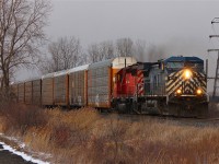 With the light fading quickly and isolated snow flurries blowing through these unit's finally show their lights at Ringold with clearance to Belle River.