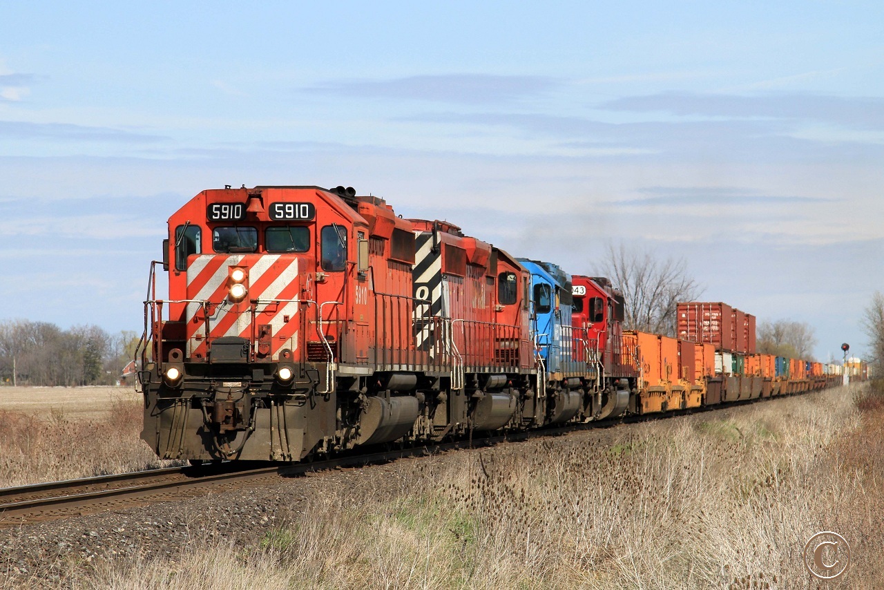 CP 5910 with CP 6050, NREX 7370 and SOO 6043 charge westward with train 241 at mile 98.88 on the CP's Windsor Sub.
