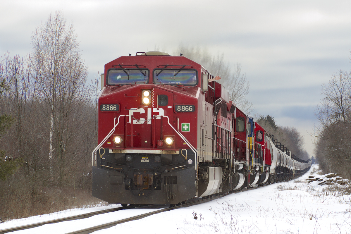 CP 641 snakes along the slight grade at Flamborough with a train of empty ethanol cars for the US Midwest.