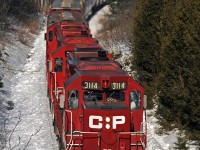 Well into the climb up Maryanne's Hill, CP 3114, 3103, and 3134 lead T07's 33 cars through the narrow cut at Tapley. 1602hrs.