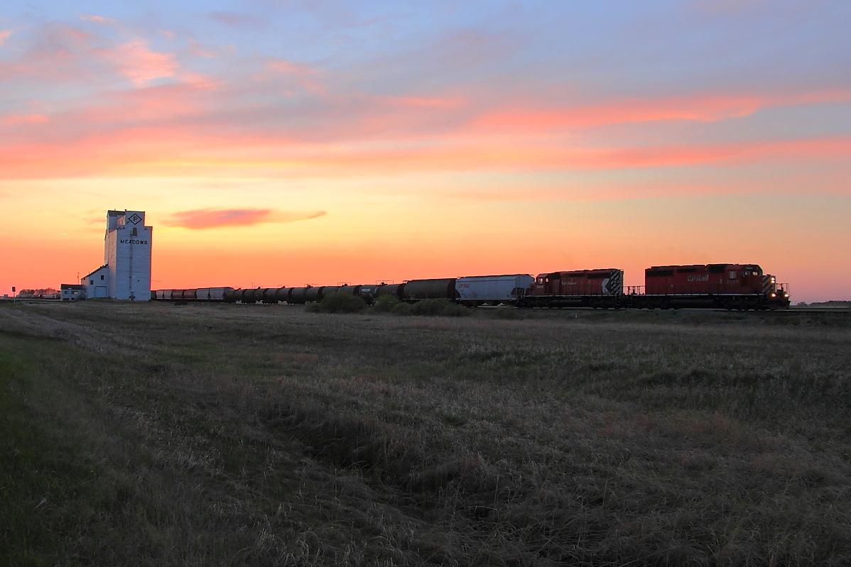 CP 418 passes the elevator at Meadows.