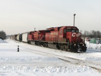<b><i>O Canada!</b></i>
<br><br>
With the afternoon sun and bright clean snow really showing a contrast to the dirty red SD40-2 and slightly cleaner GE, CP 158 kicks up some white stuff cruising through Guelph Junction, past OSR's enginehouse and facilities. Happily there was a rather unique unit in the lead today: CP 6028 features the one-of-a-kind "Triple Flags" livery: someone added an extra Canadian flag onto the usual half-US half-Canadian flag logos on both sides of the unit. Coupled with the typical Canadian winter environment and beaver on the trailing unit, all that's missing in this shot is an igloo, a mountie and a dog-sled team!
<br><br>