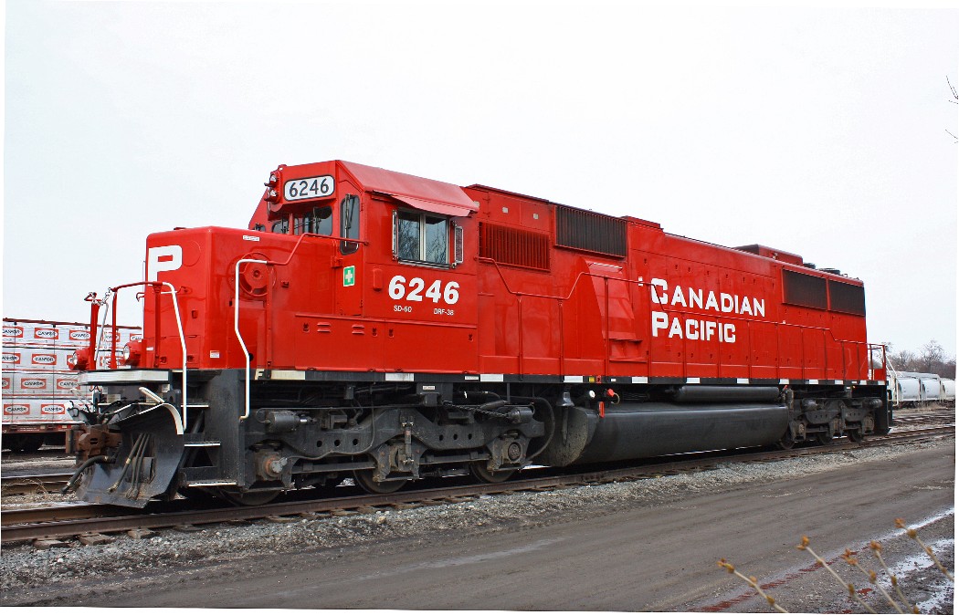 After slipping in the mud (but I saved my camera), I finally got my shot of recently rebuilt ex. Soo 6246, sitting tied down on the RIP track lead. It would later be added to 641 the westbound empty ethanol train that Stephen C. Host caught at Puslinch.