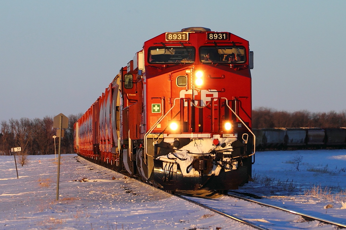 Potash empties head for Portage at sunset.