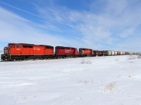 A red barn leads an all EMD lash-up towards Meadows.