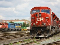 CP 9107 accompanies 9120 and 8208 on what could pass for a company photo-freight, based on the first few CP boxcars. 6050, CEFX 3183 and ICE **11 sit light on the siding beside an intermodal train led by 8846 and 8562. 