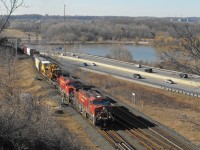 CP 9637 and 9640 have taken the light at Desjardins and will now simultaneously pass over the canal and under the York Blvd. bridge.  