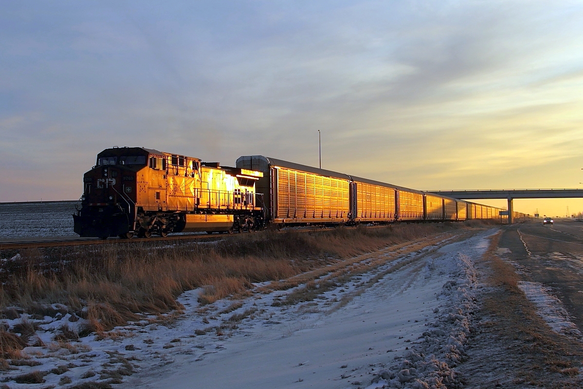 CP 9769 brings up the rear of 112 as it enters the Winnipeg city limits. This units was used on the Holiday Train a few years ago which is clearly highlighted by the sunlight.
