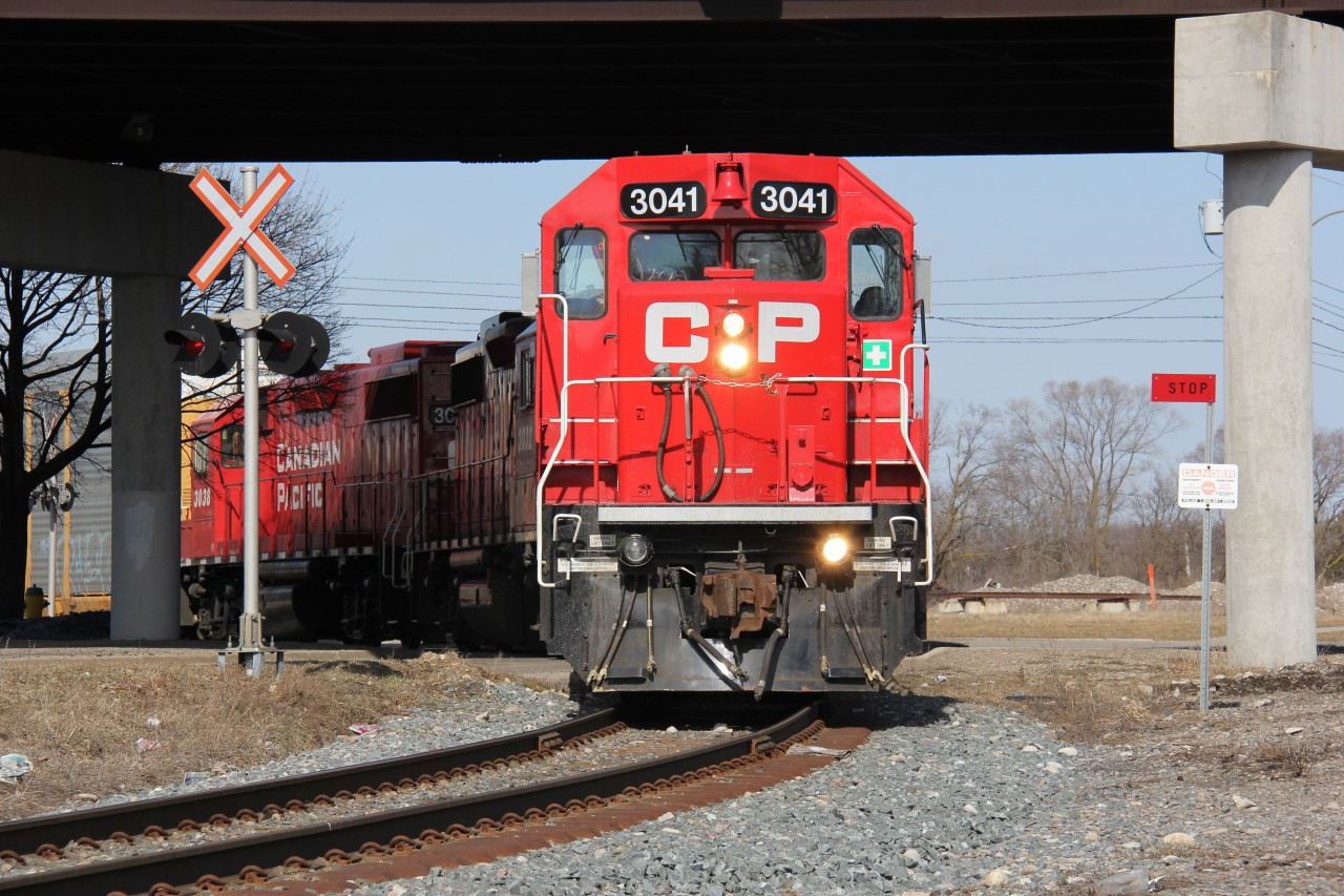 The Wolverton Turn with newly-repainted CP 3041 on the point finally pulls loaded autoracks off the Waterloo Sub and onto the Galt Sub. The train had to wait for CP 8811 East (CP 254?) to come through on the main. There were problems with the 8811 East which held up the Wolverton turn - the train was longer than it was supposed to be; extra cars had to be set-off near Killean.