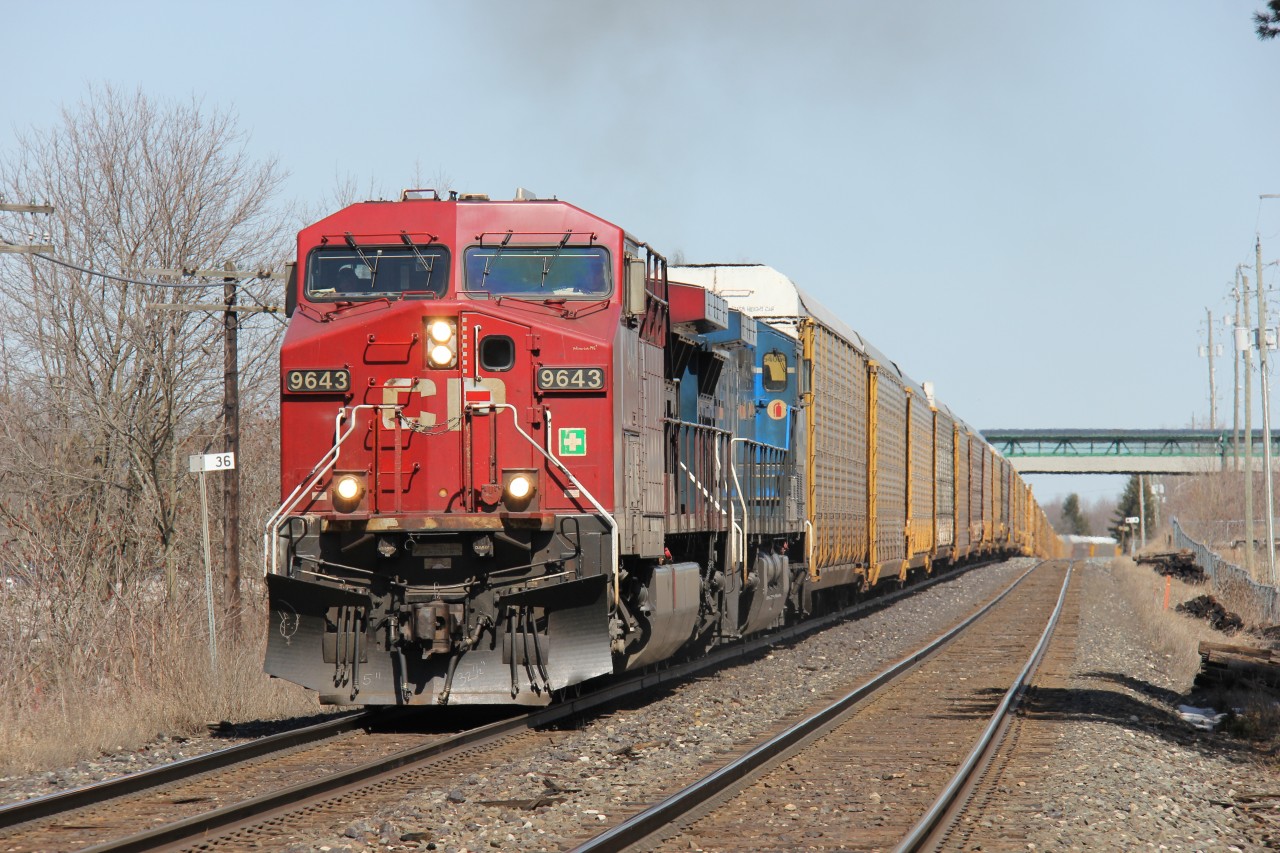 CP 9643 West accelerates after having some sort of problem with their train. The crossing gates at Appleby Line were down for a long time as a number of motorists were waiting. Despite the hold up, no one seemed frustrated or upset; in fact, people got out of their cars and snapped a few pics! It was a nice sunny spring Saturday of the Easter weekend!