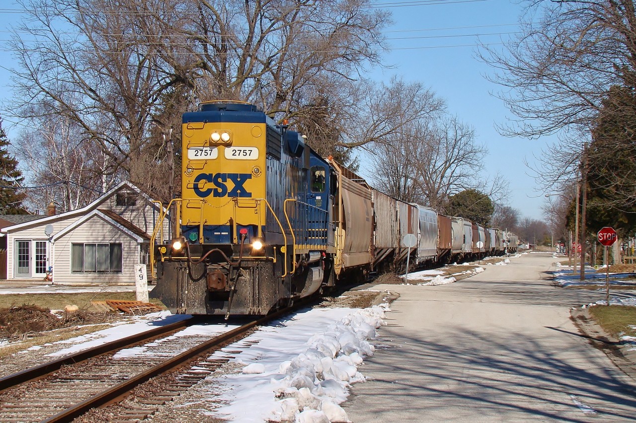 The local to Tupperville heads through Port Lambton practically street running with 19 cars behind a new locomotive to the area. After dropping off 11 at SW CO-OP in Wallaceburg, he'll continue onto Dresden to run around his train before heading back west to switch out Tupperville.