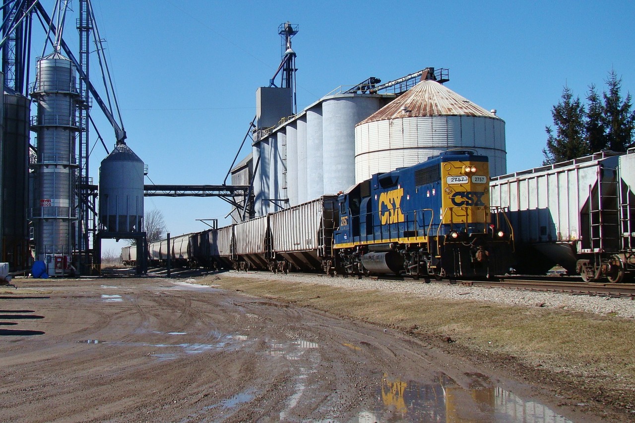 The Local (which I believe still calls by the name D924) makes his way through Tupperville, on his way to Dresden so he can run around his train to switch out this facility. CSX won't be operating on this portion of the line much longer as short line operator CANDO Ltd. will be taking over operations.