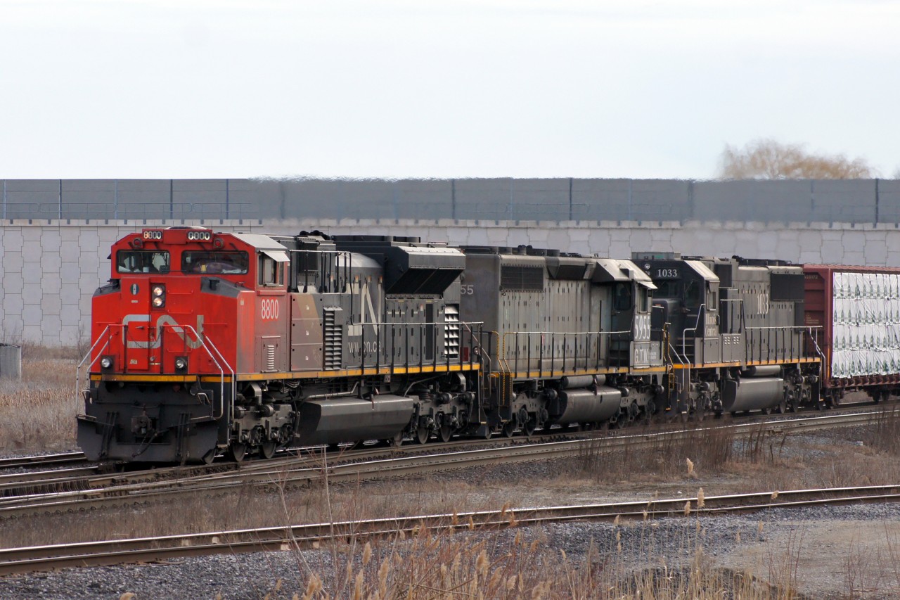 The sun was still low in the sky when 314 with the SD70M-2 class unit leading rolled by on the home stretch of its trip into Mac Yard, shortly after having met 301 between Doncaster and Snider. Trailing are the GTW 5955 and IC 1033. Had 314 made it by any earlier, this shot would have been blocked by 301's tail end which is just outside of the frame.