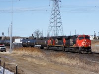 Despite today being a holiday there is no shortage of action at Snider. Crews are demolishing a warehouse west of Keele Street (visible in the background), CN staff is maintaining equipment at the switch plant, and trains are rolling by, such as this eastbound seen passing between the CN Snider signs. Behind the head end power are 113 cars, then the IC 1005 as a DPU, and another 41 cars trailing it.