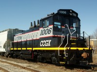 Waiting to be picked up off the interchange. Cando SW1200RS 1006, gleaming in its fresh paint, awaits the CPR to  tie onto it and continue its journey to Terrace Bay Ontario.