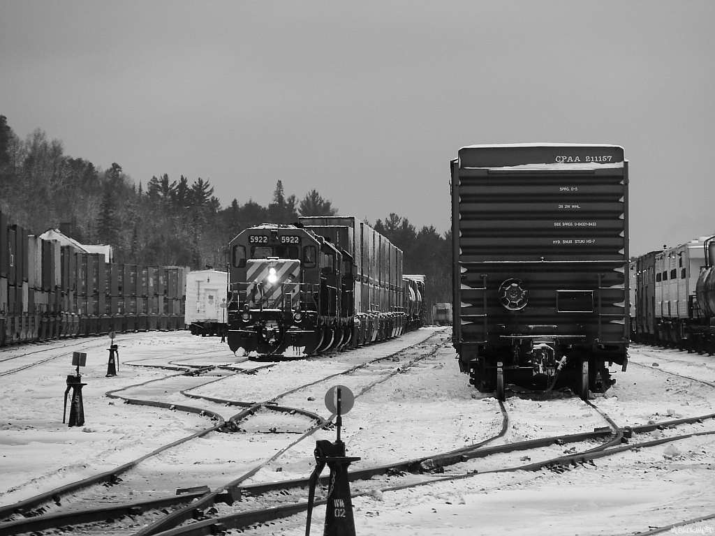 CP 5922 South staged in Cartier with her train in 2 pieces, the head end with a block swap they lifted here and some Sudbury traffic tied down in track 5, with the balance in track 7.