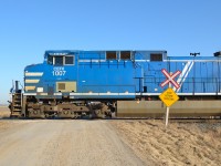 CEFX 1007 leads CP 243 past the Sinclair Road crossing at Jeannette.